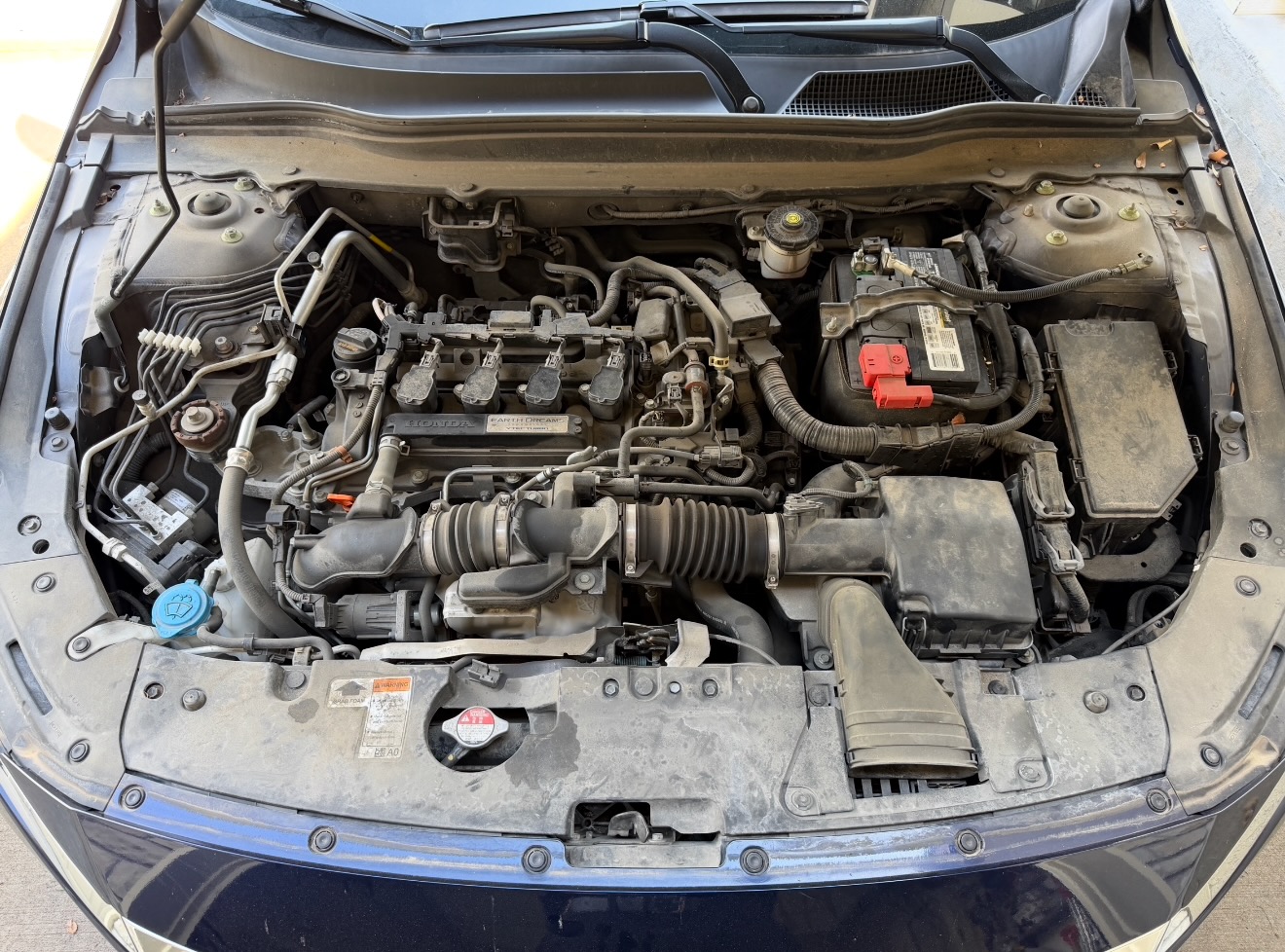 Honda Accord engine bay before detail — grime and road contamination — Premier Detailing LLC Johnson County KS