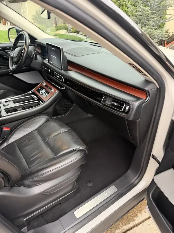 Lincoln SUV front passenger side with wood trim after detailing