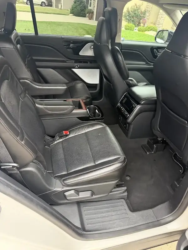 Lincoln SUV second row captain's chair and console after detailing in Shawnee